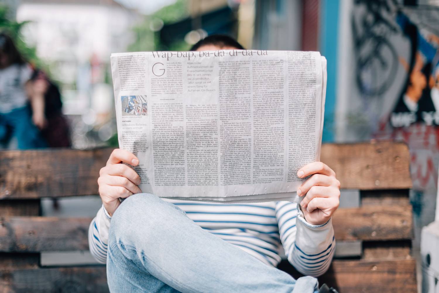 Adult reading the newspaper