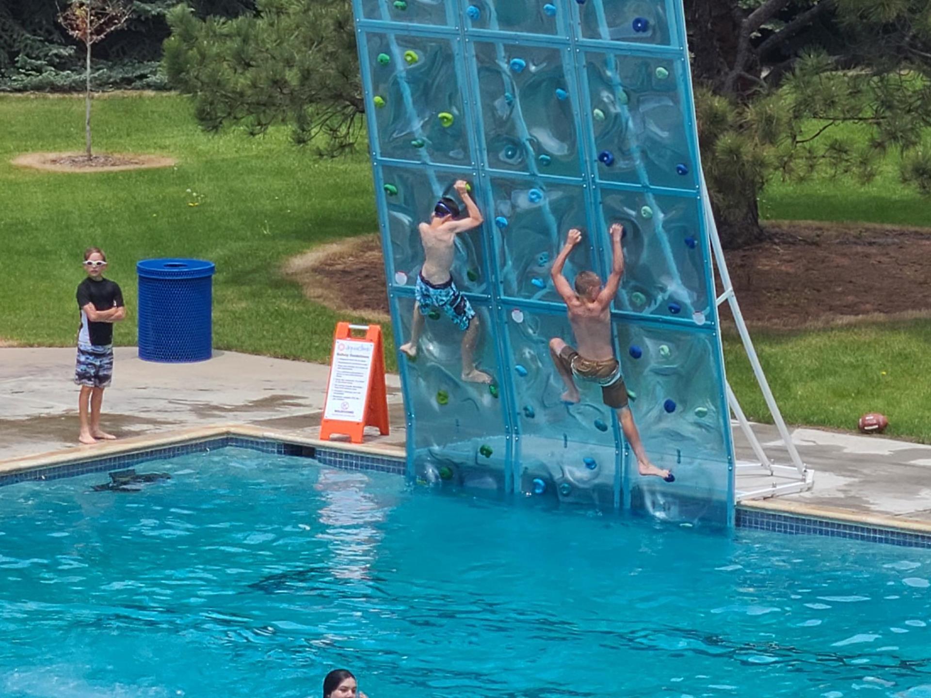 kids on aqua climb wall