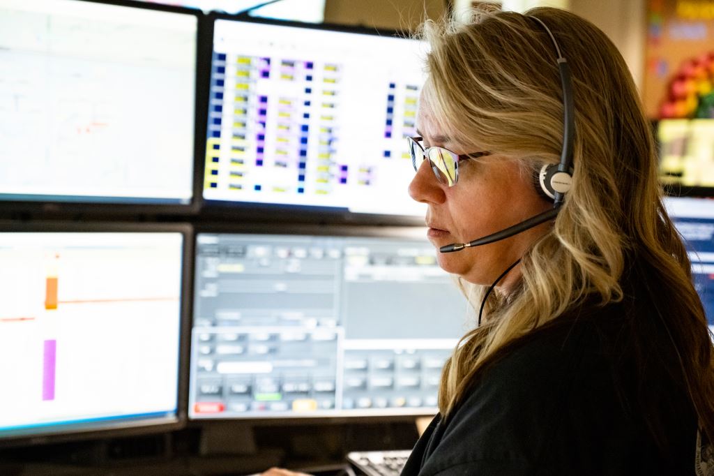 dispatcher looking at computer screens