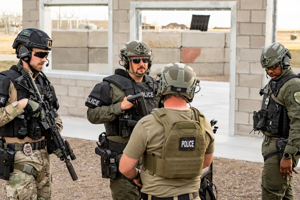 SWAT team discussing a training session