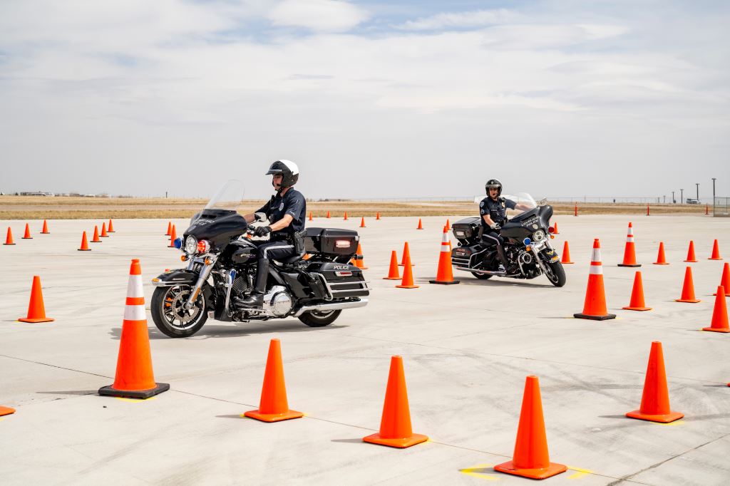 police motorcycles at training center with traffic cones