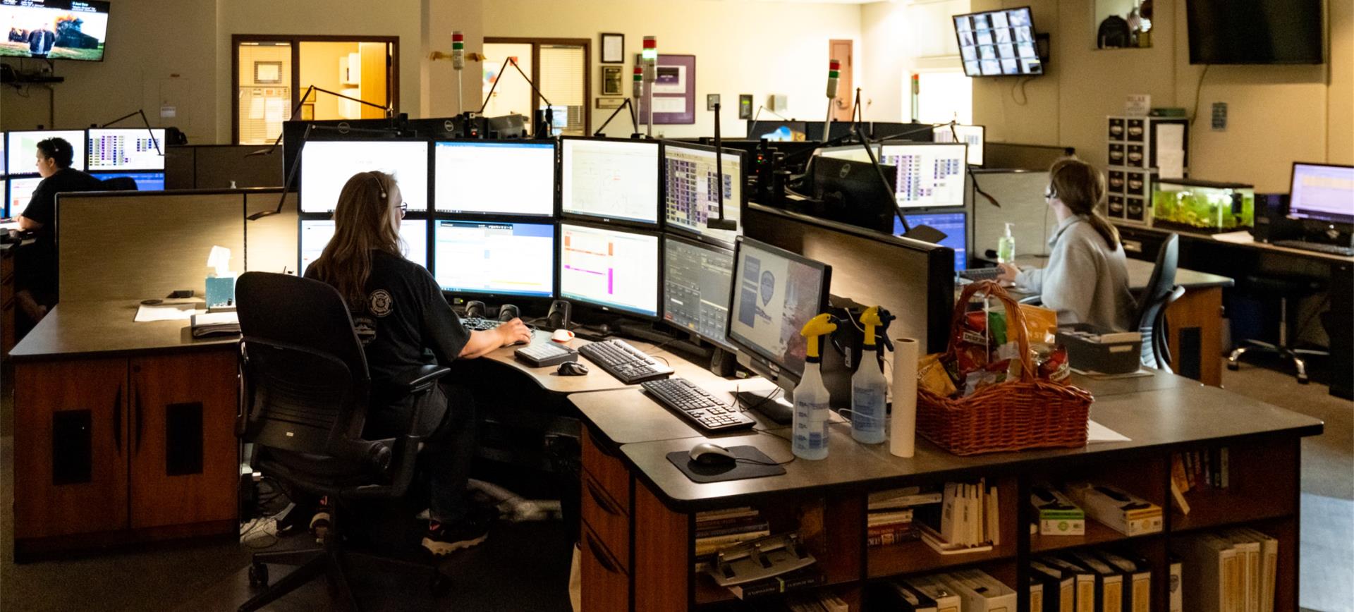 Dispatch personnel at computers in Communications center