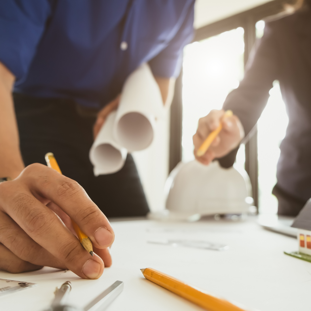 Two people reviewing a development plan