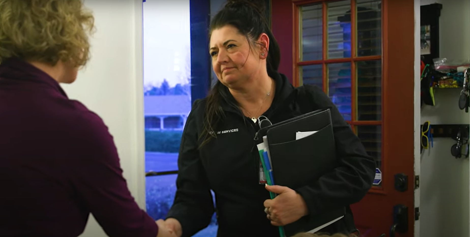 victim services personnel greeting another person